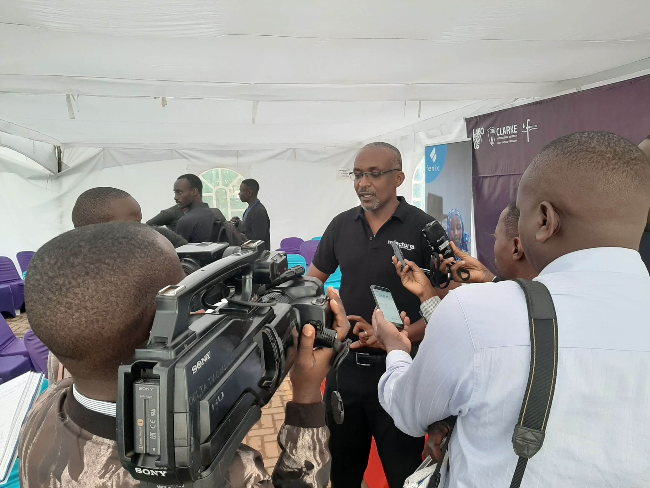 Michael Niyitegeka, the Programs Director sharing with the press